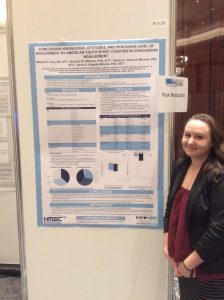 Melissa Kay next to her concussion conference poster