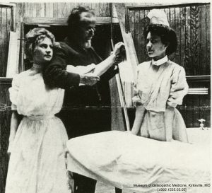 Dr. Still demonstrates osteopathic manipulation on Augusta Teuckes, an ASO student nurse. Museum of Osteopathic Medicine [1992.1535.02.03]