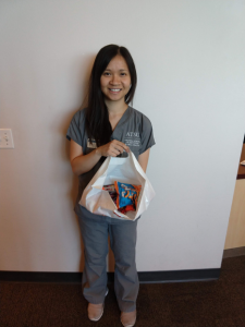 Arizona campus winner of the candy guessing game with her prize